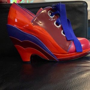 Wedge heel ribbon lace up shoe.